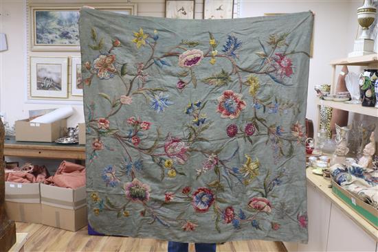 A crewel worked panel and another similar in green